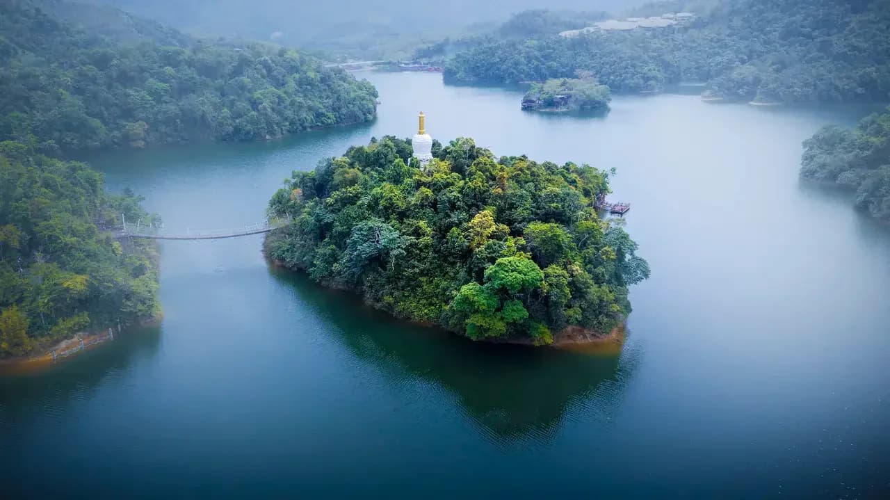Aerial view of the wooded island within the lake at Jade Island